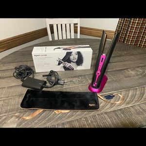 Brand new dyson flat iron. Used 1 time and received another as a gift.